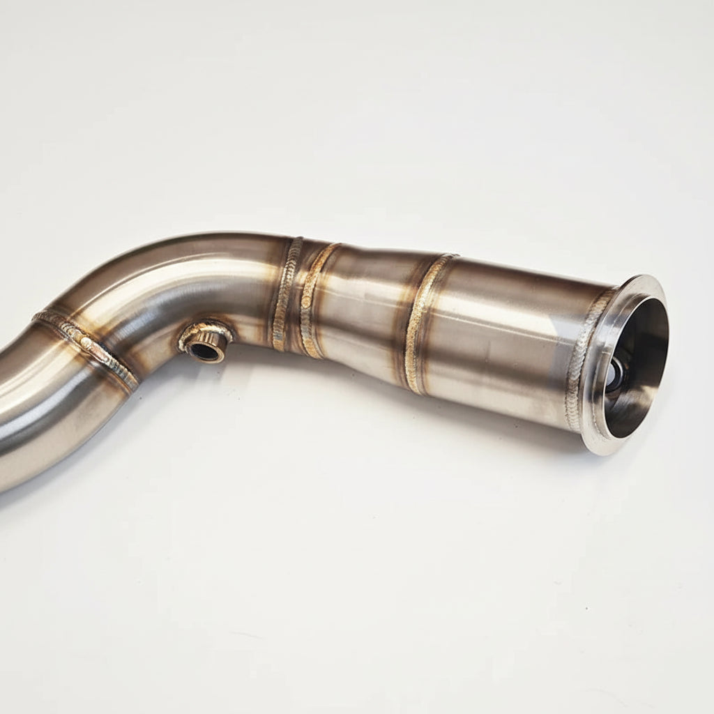 Metallic exhaust pipe with 'Rumble Performance' branding on a white background