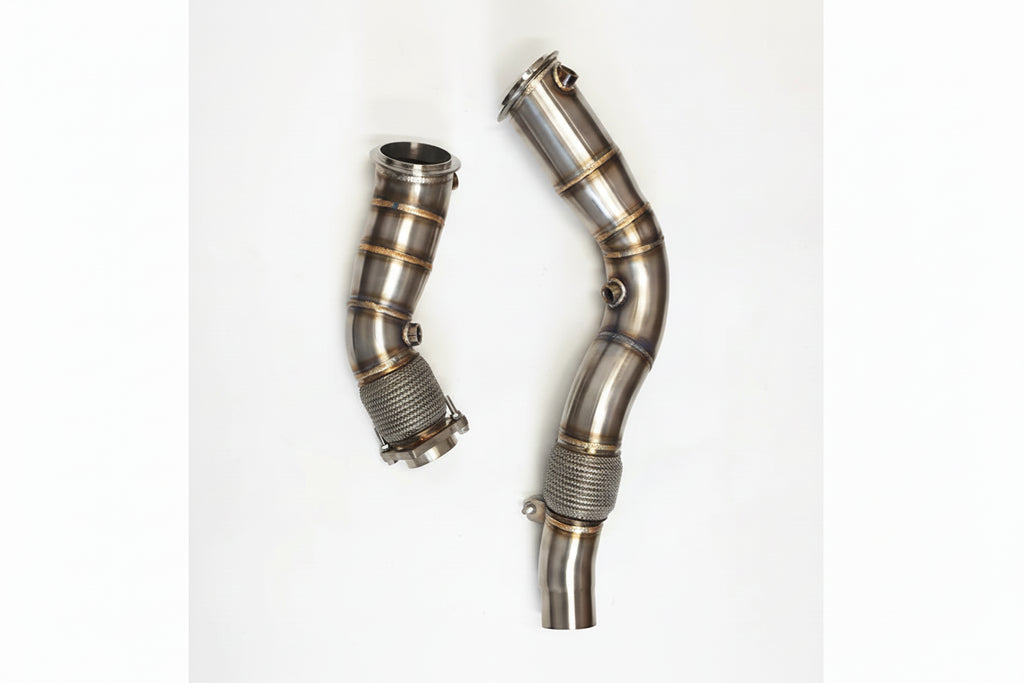Two metallic exhaust pipes with Rumble Performance branding on a white background.