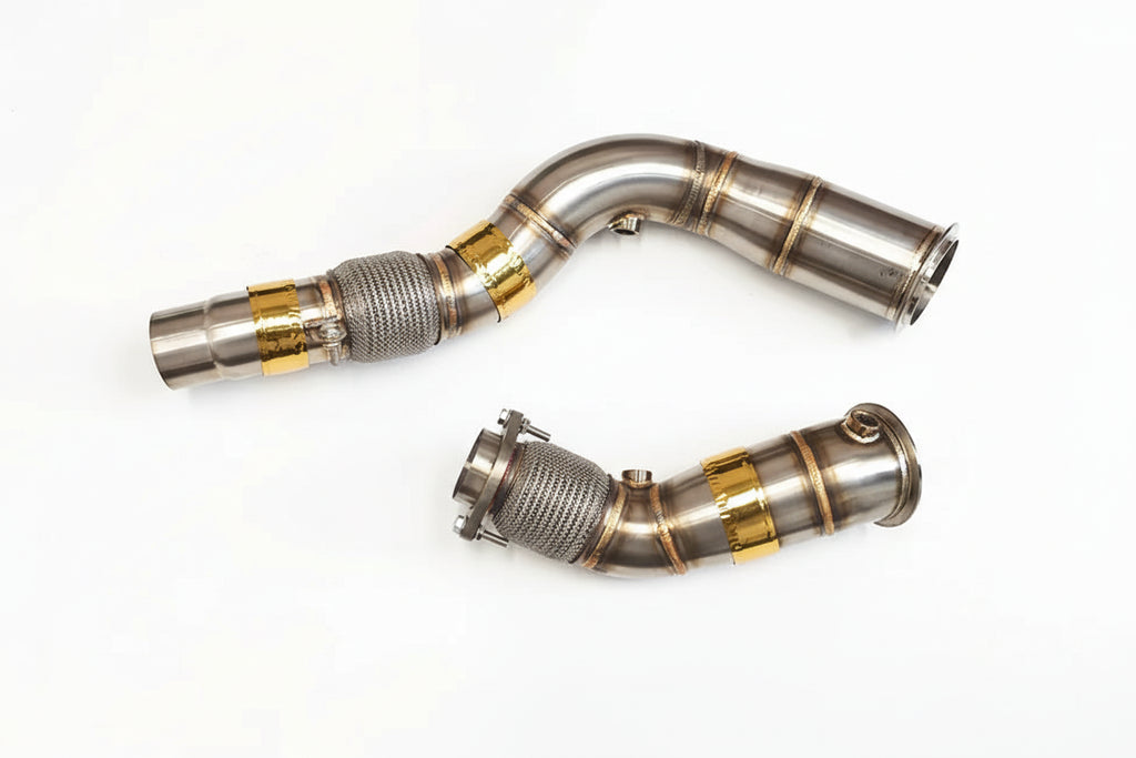 Two metallic exhaust pipes with 'Rumble Performance' branding on a white background.
